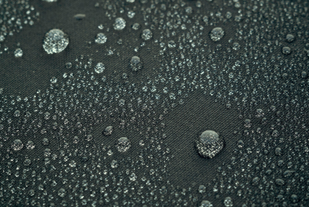 Water droplets on grey waterproof fabric