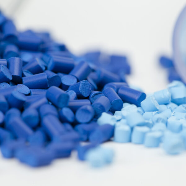 Light blue and dark blue polymer pellets