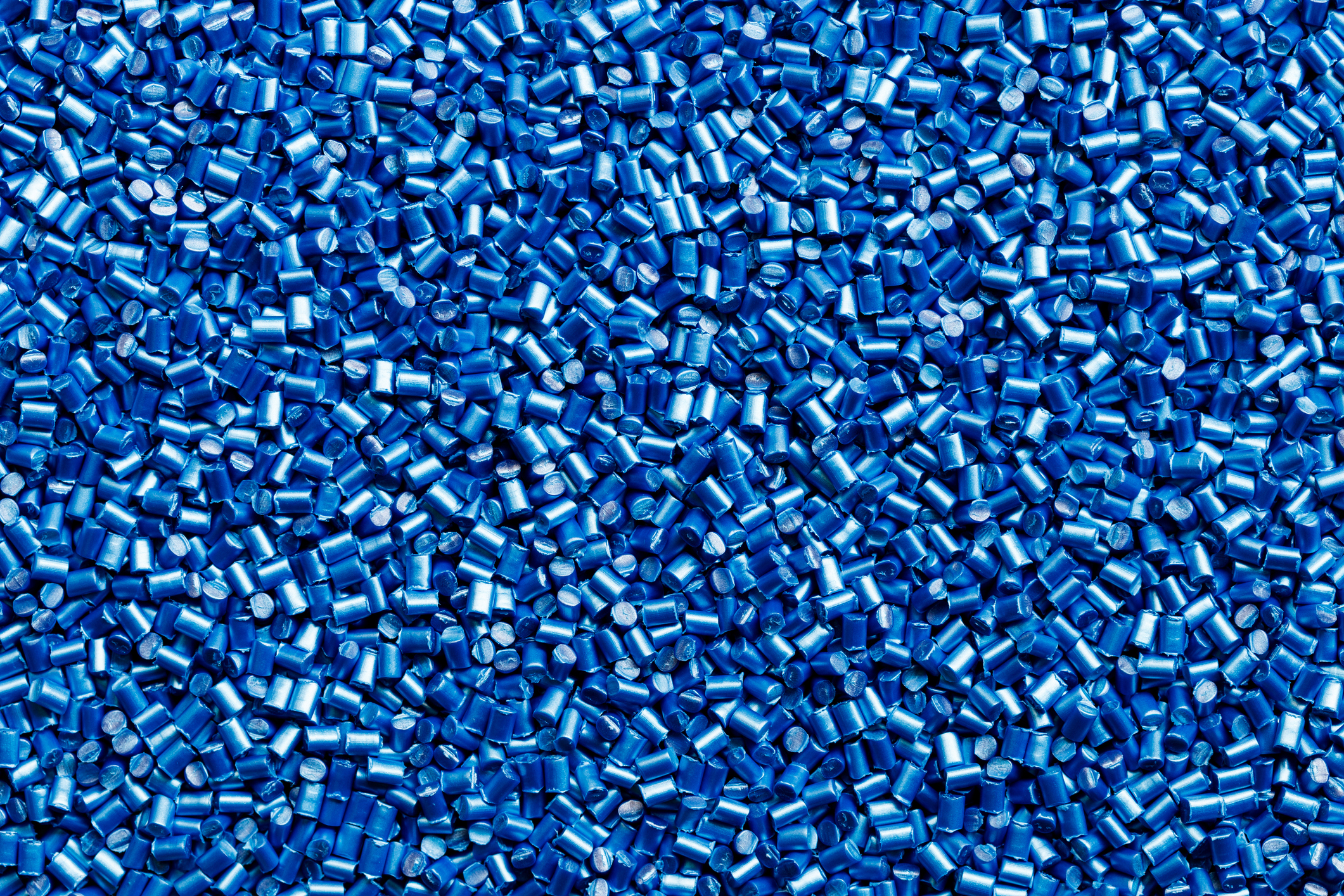 Thousands of blue polymer pellets