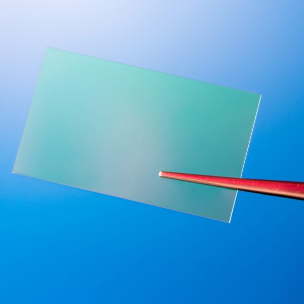 Slide of optical glass on a bright blue background