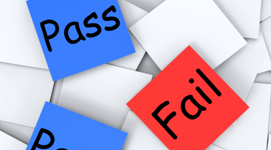 adhesive post-it notes saying pass or fail