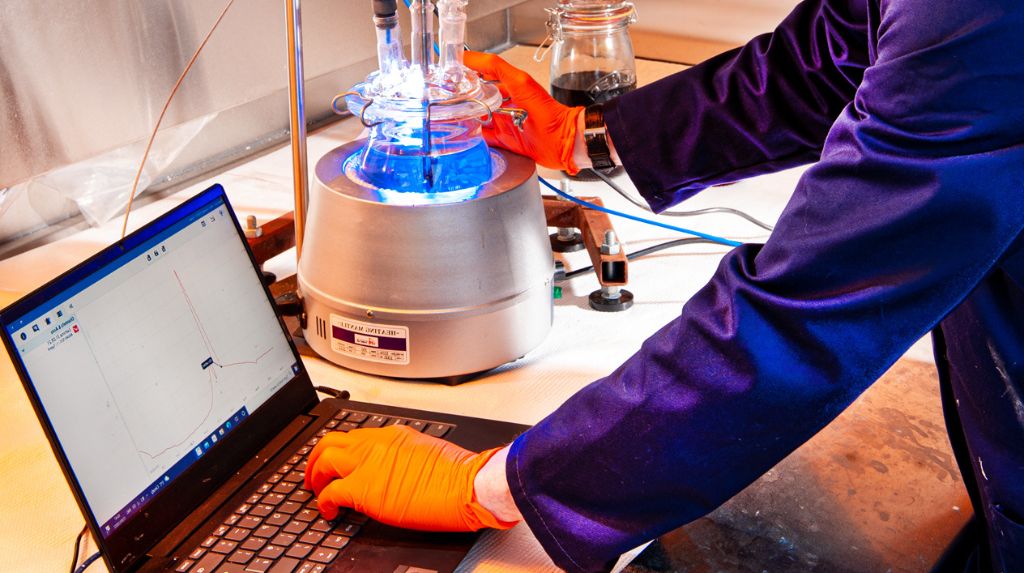 Lab person looking at results of a coating application experiment